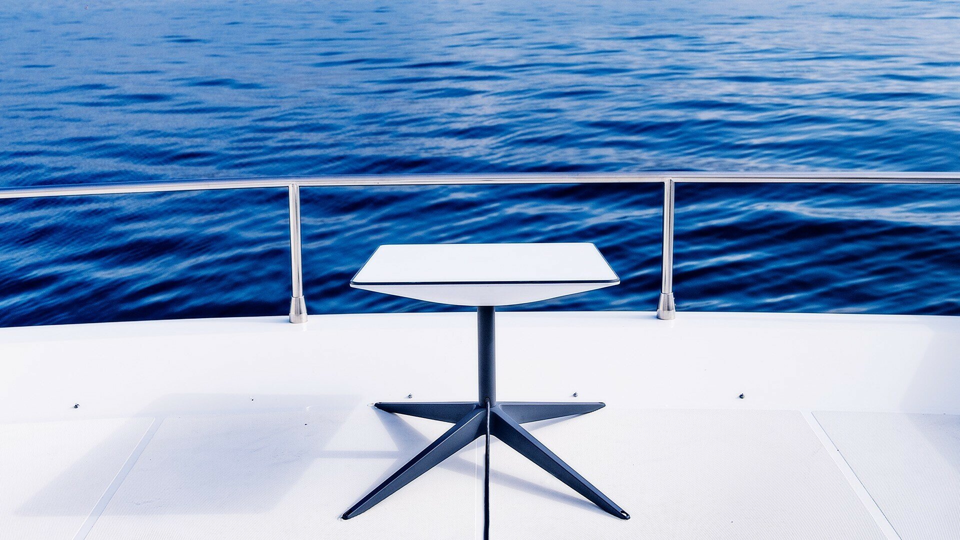 A Starlink internet kit sitting on the deck of a yacht.