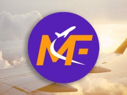 Orange and purple Matt's Flights logo over plane wing image