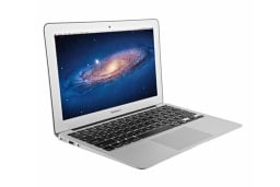 Silver macbook air with galaxy image on screen