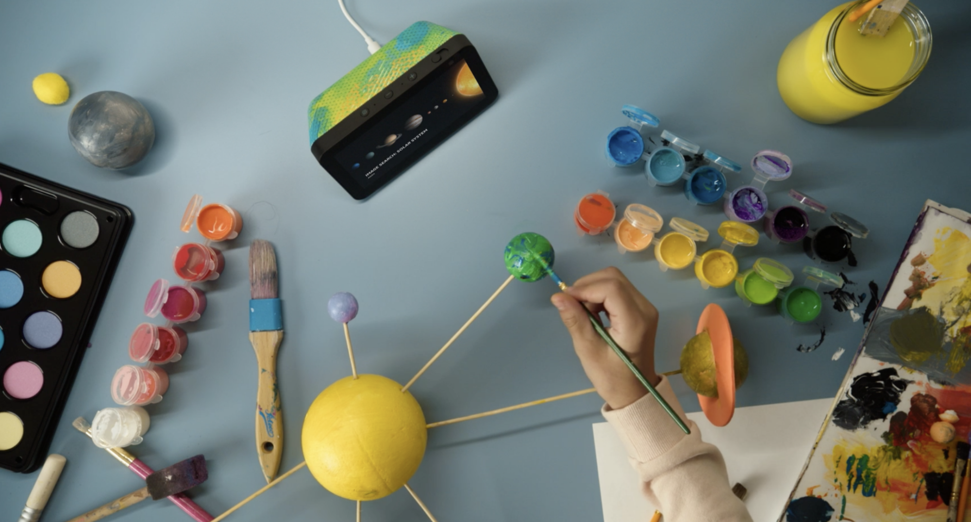 echo show 5 kids surrounded by arts and crafts supplies