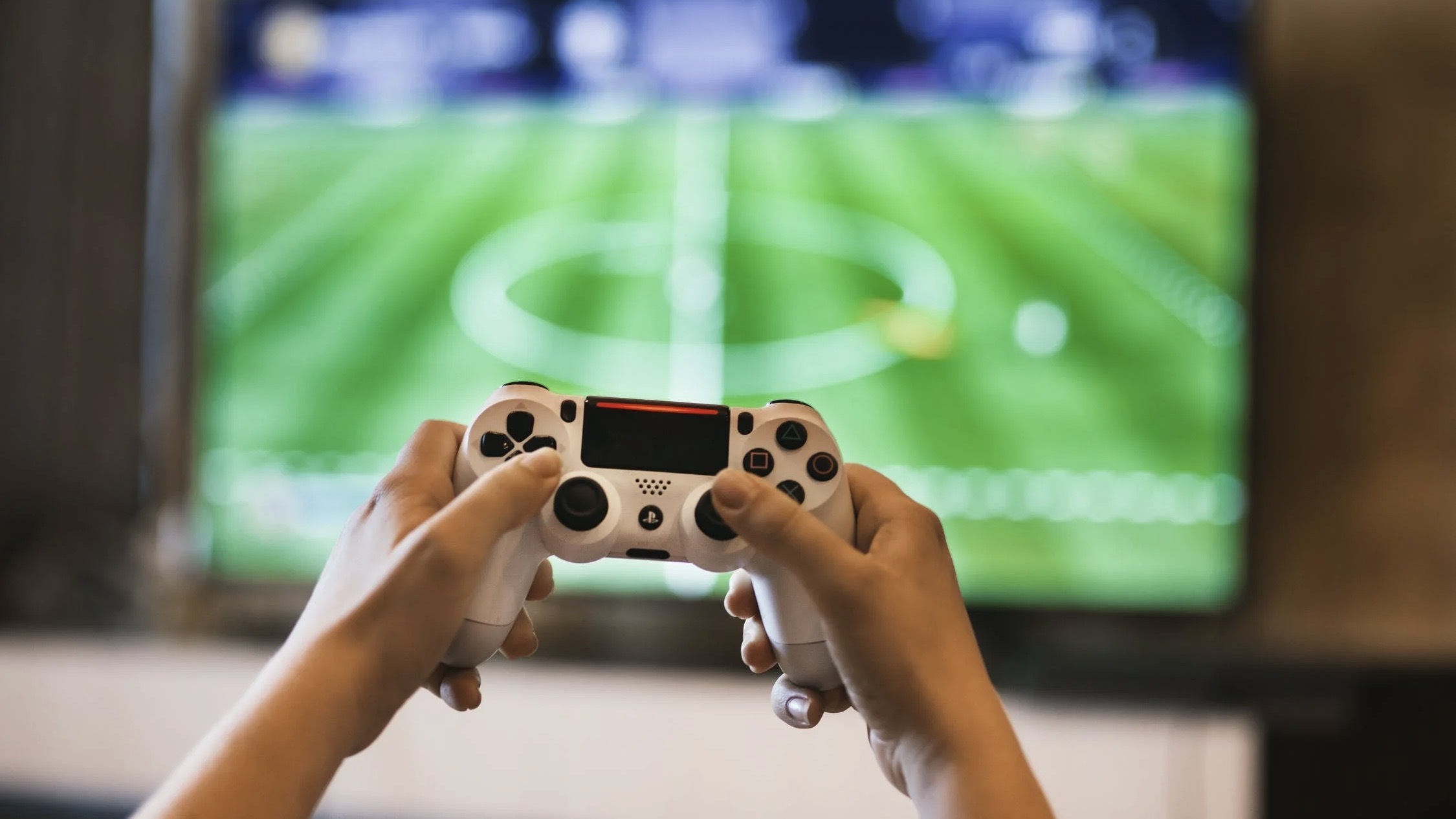 Person playing a game on a Playstation.