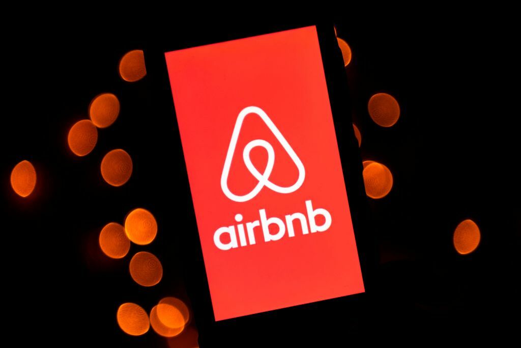 The Airbmb logo displayed on a smartphone.