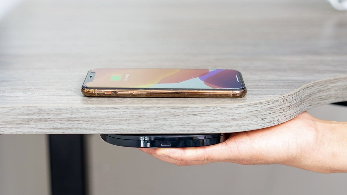 Hudly Invisible Wireless Charger charging a phone.