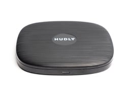 Hudly Invisible Wireless Charger, a black disc, on a white background.