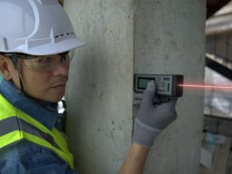 Person using the VH-80 Bilateral Laser Distance Measurer.