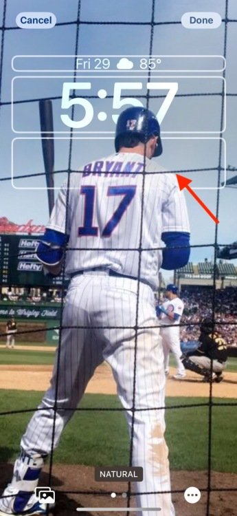 Screenshot of an Apple iPhone background showing a baseball player's back.