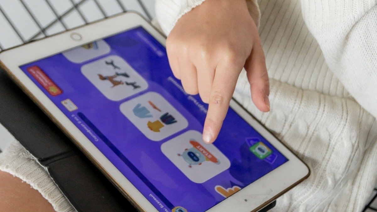 Child playing with the LogicLike Brain Games and Tricky Puzzles: Lifetime Subscription.