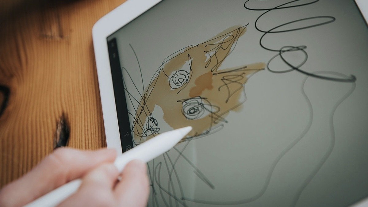 Person using a tablet to draw.
