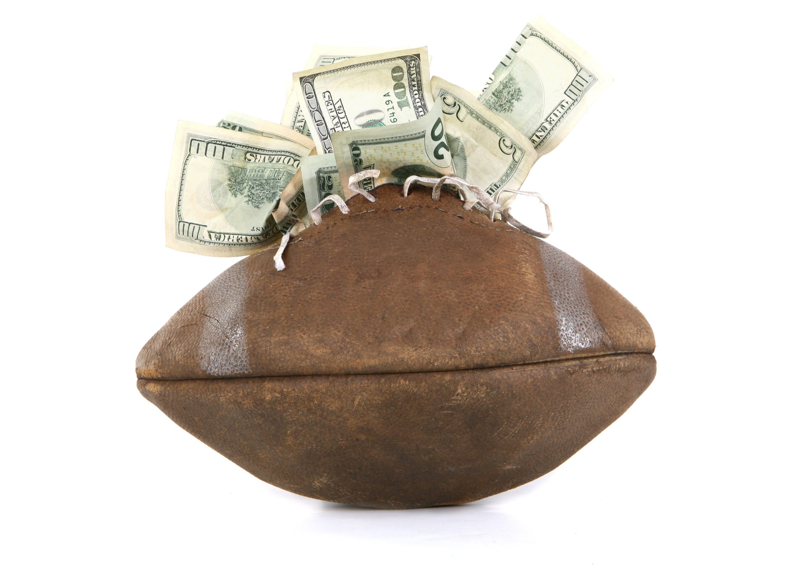 money stuffed into an old football