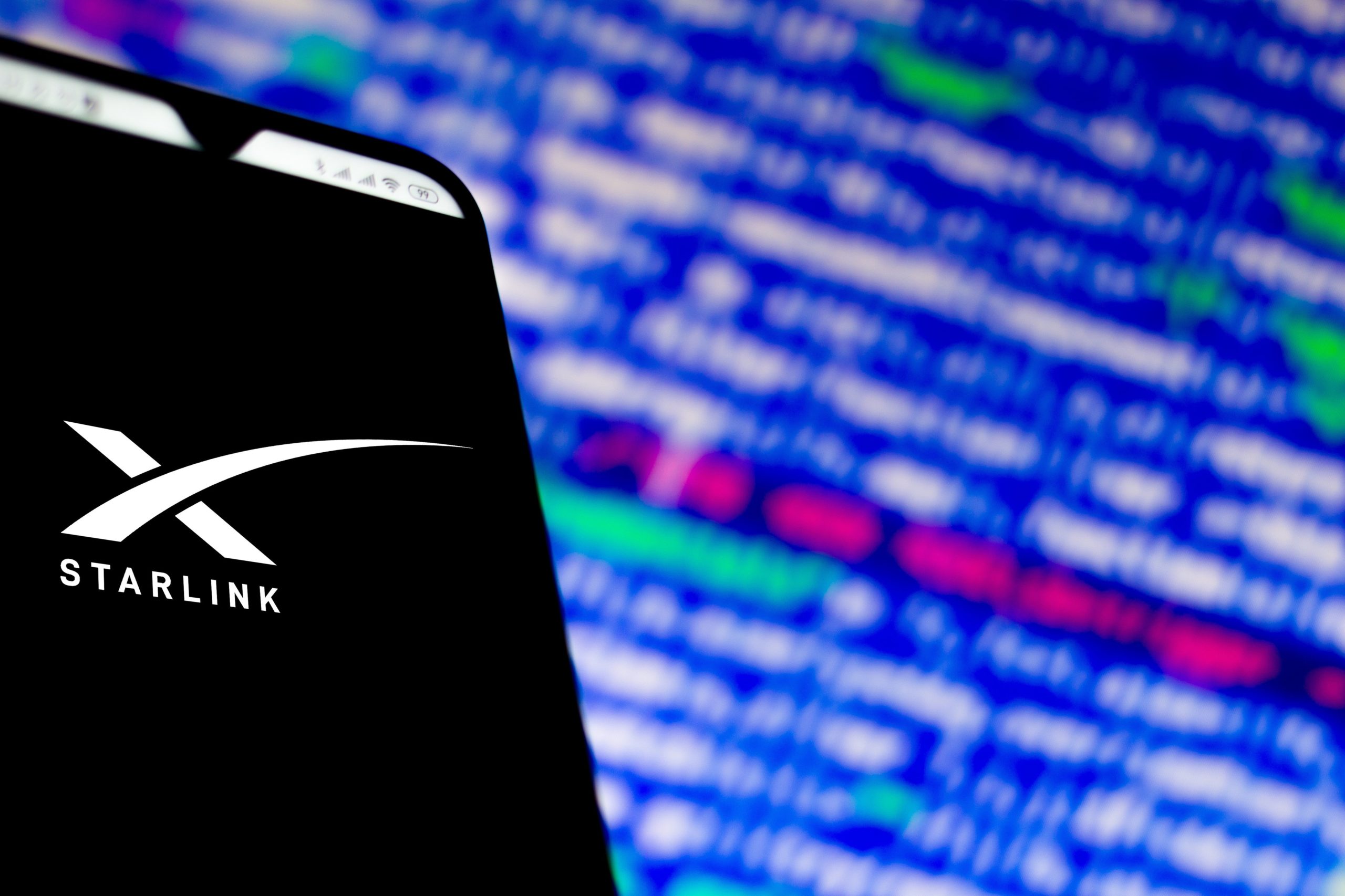 phone with black and white starlink logo