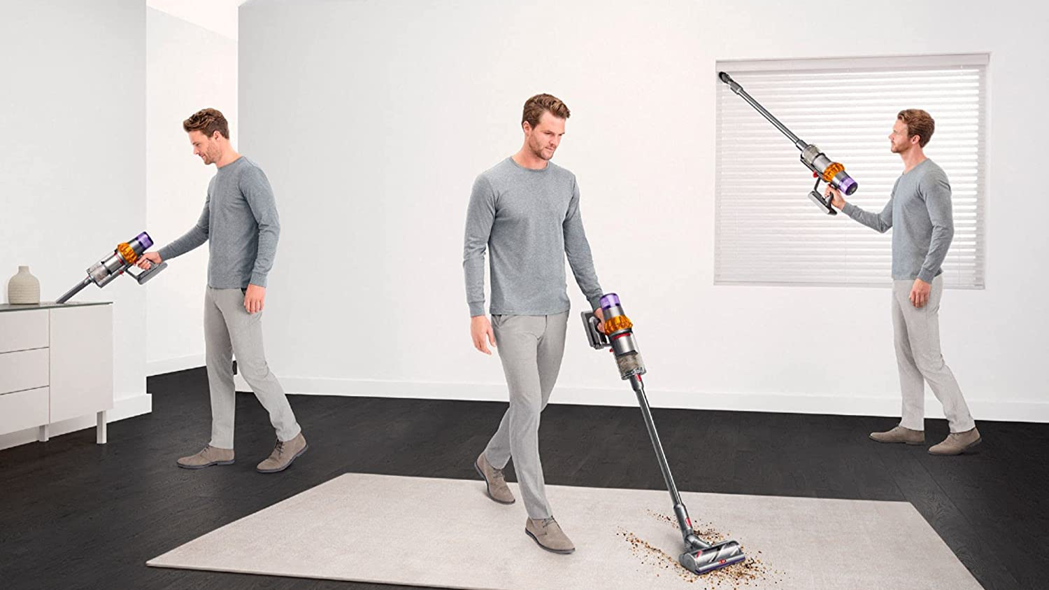 A man using a Dyson vacuum