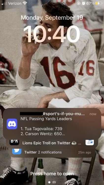 iPhone lock screen screenshot showing notifications bunched together at the bottom of the screen after iOS 16 update