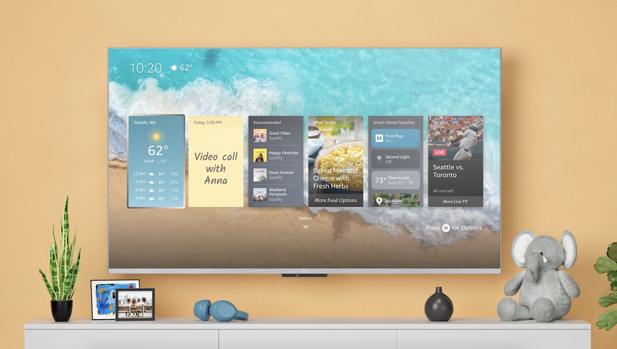 Amazon Fire TV hanging on yellow wall above furniture