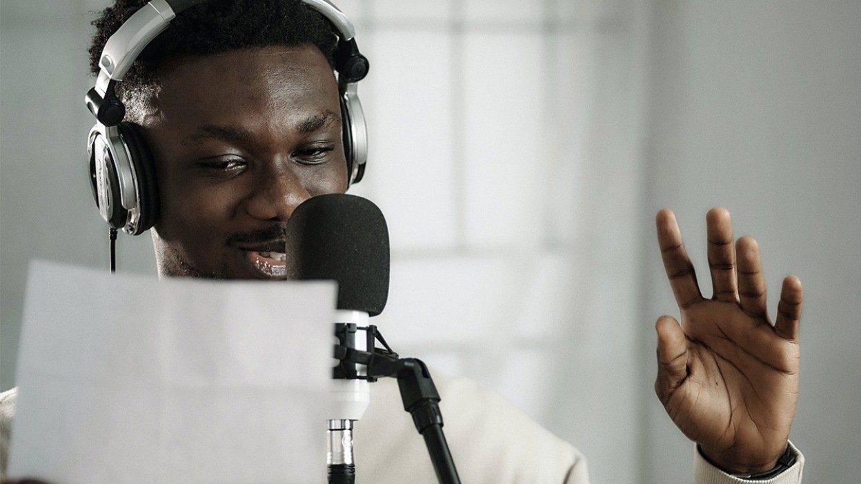 Man speaking into microphone