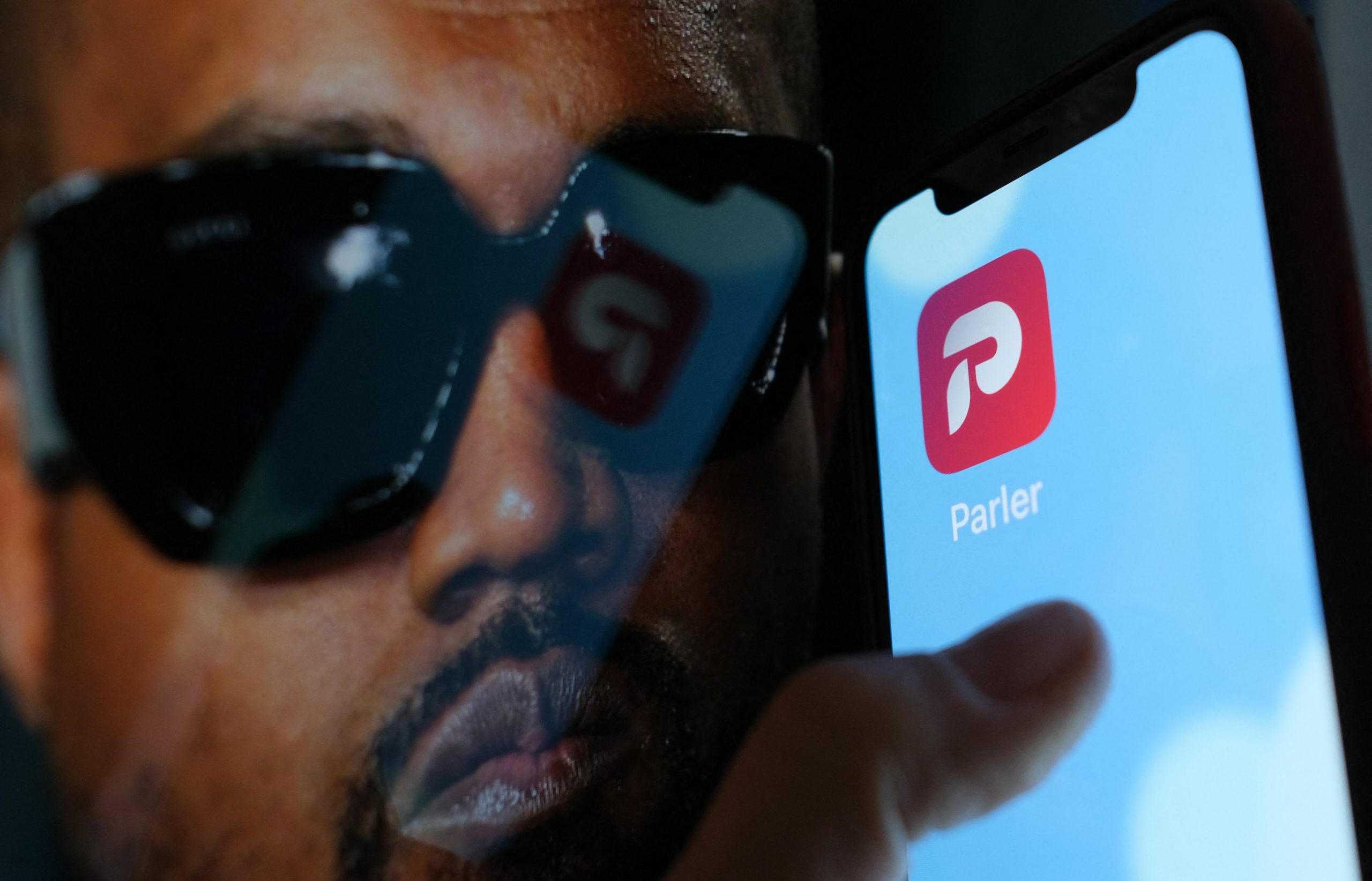 Kanye West and the Parler logo