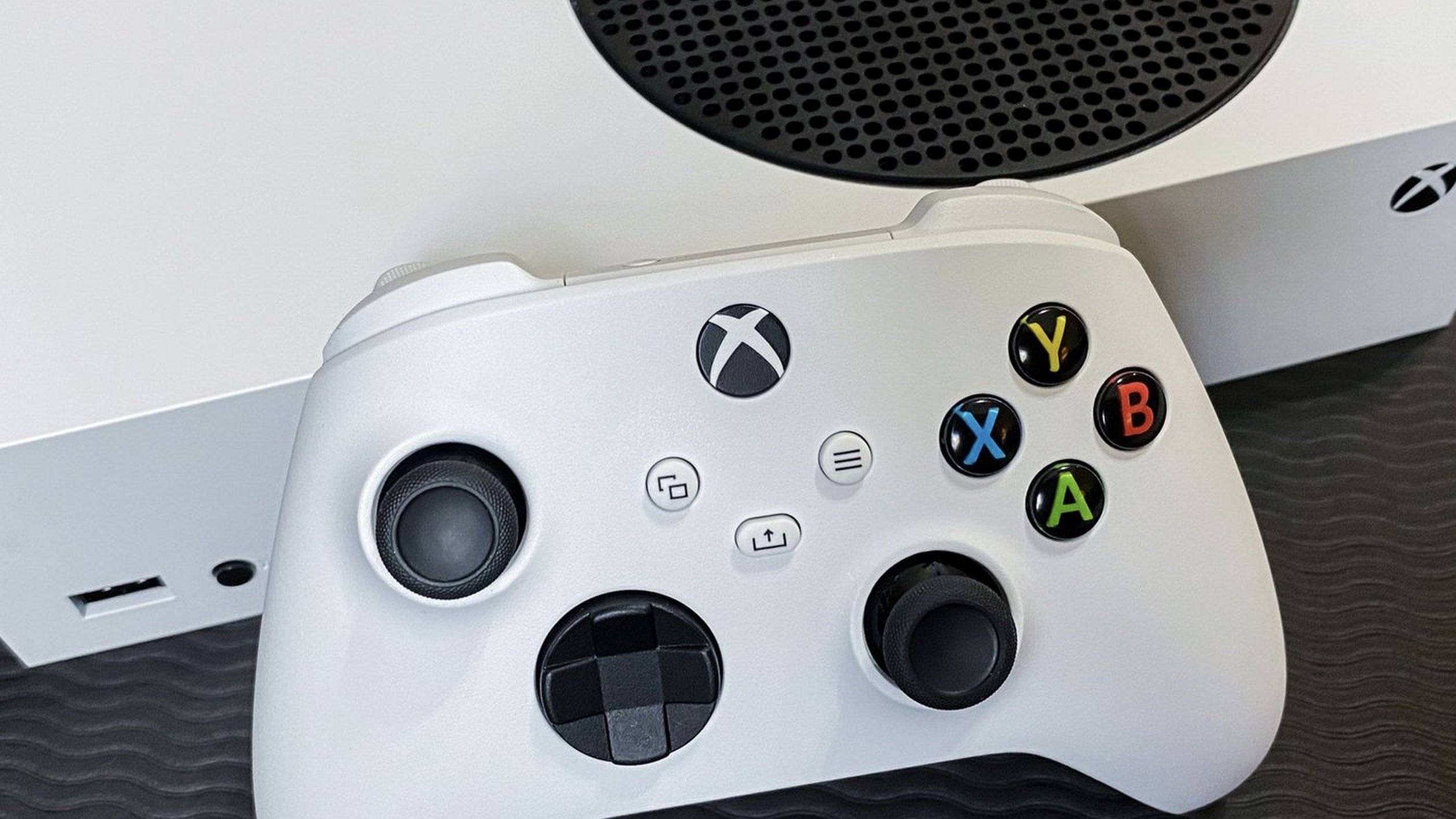 xbox controller propped against the xbox series s 