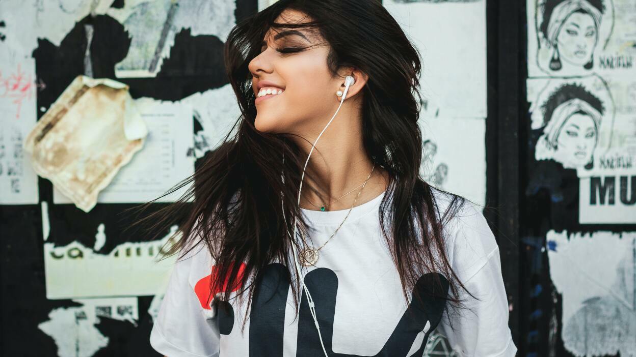 Girl listening to earphones