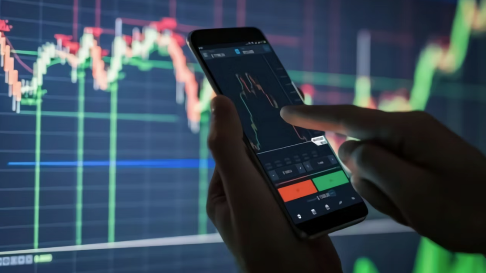 person's hands checking stocks on phone