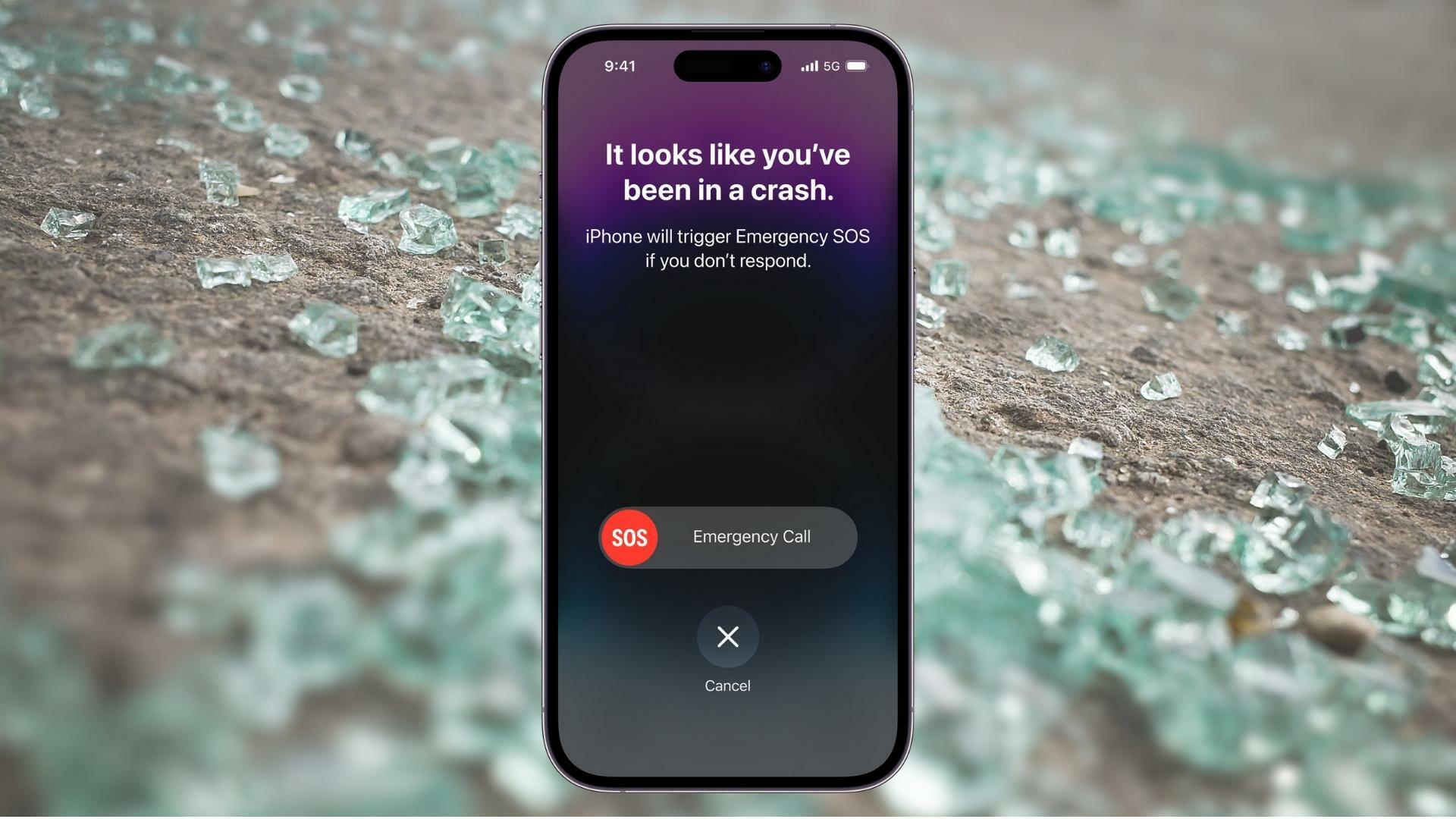 iPhone showing crash detection against an image of shattered glass