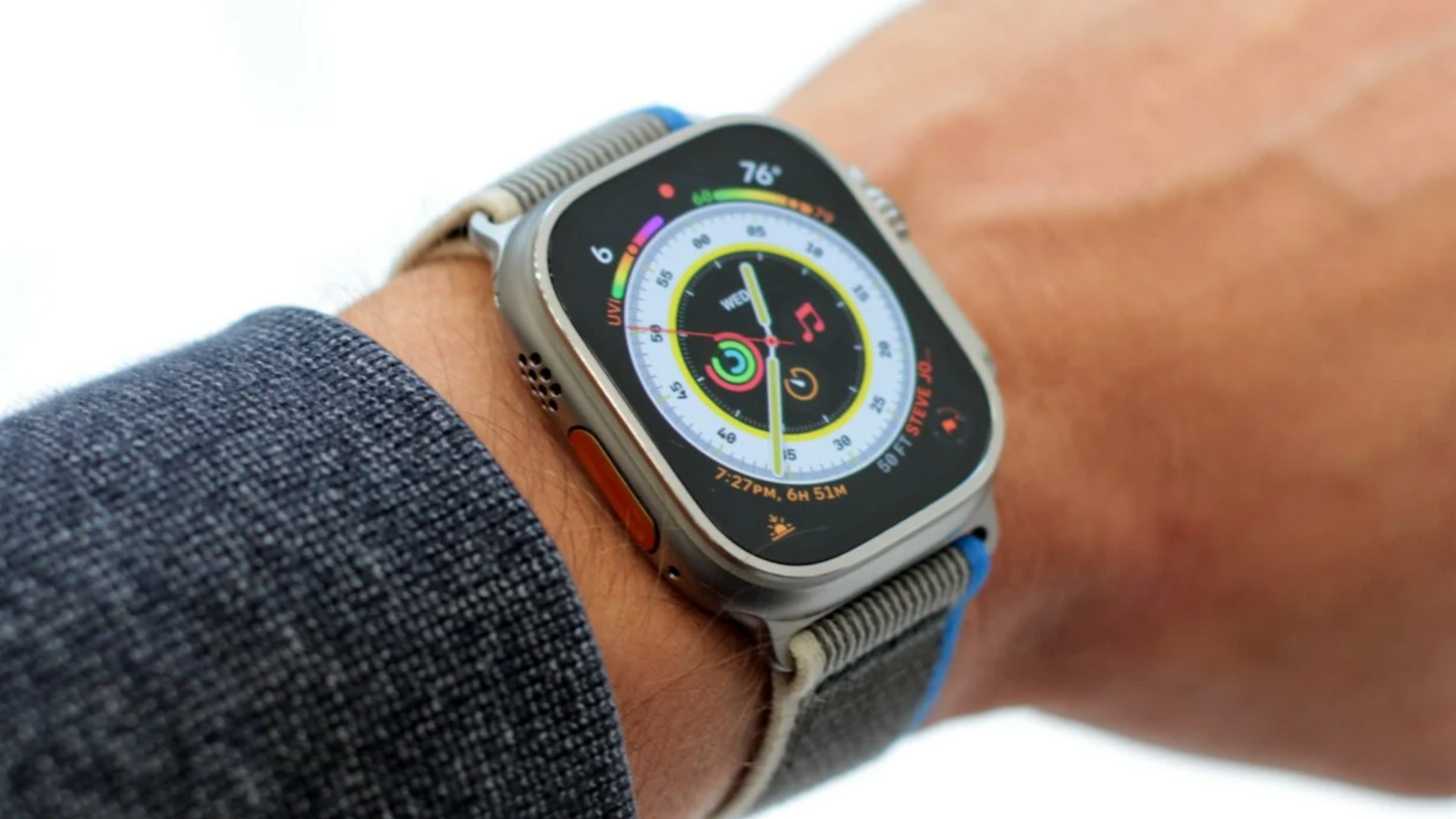 Apple Watch Ultra worn on wrist on white background