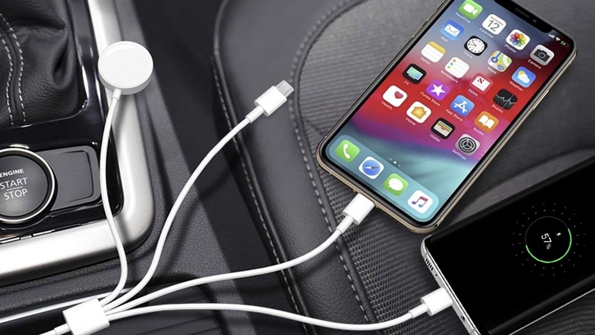 4-in-1 Multi-Port & Apple Watch Charging Cable charging a phone in a car.