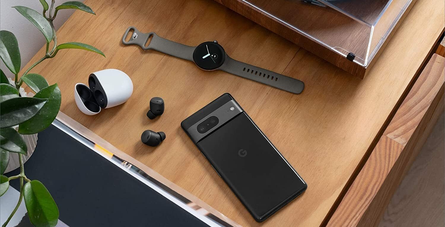 Google pixel phone, watch, and earbuds all on a table