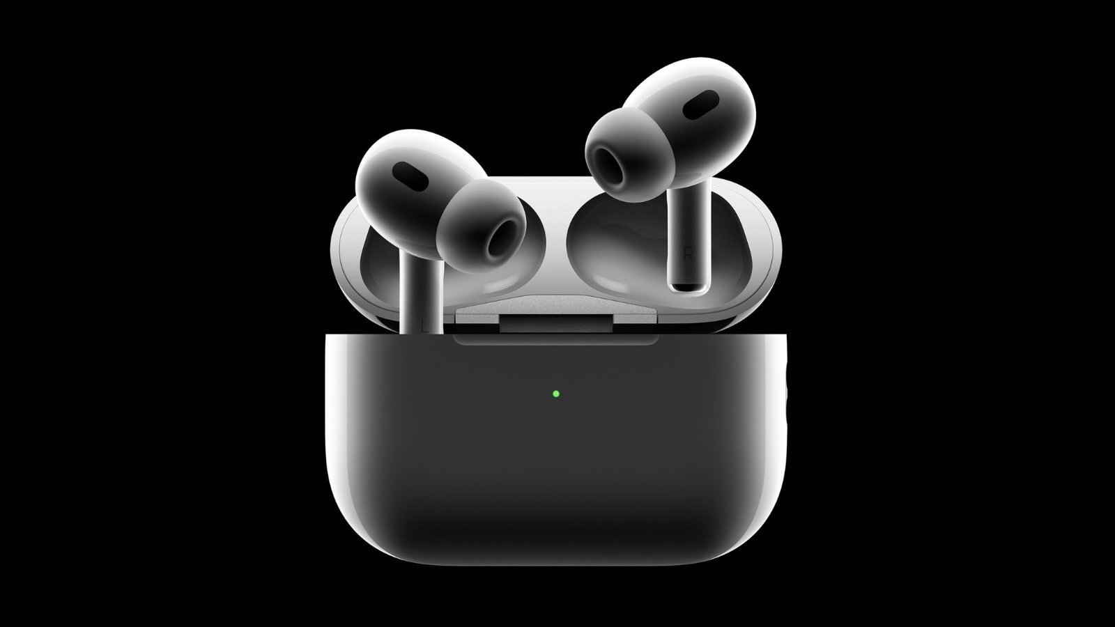 A pair of second-generation AirPods Pro with their charging case against a black background.