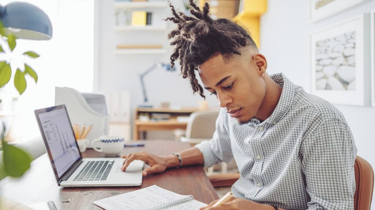 Person typing on a computer.