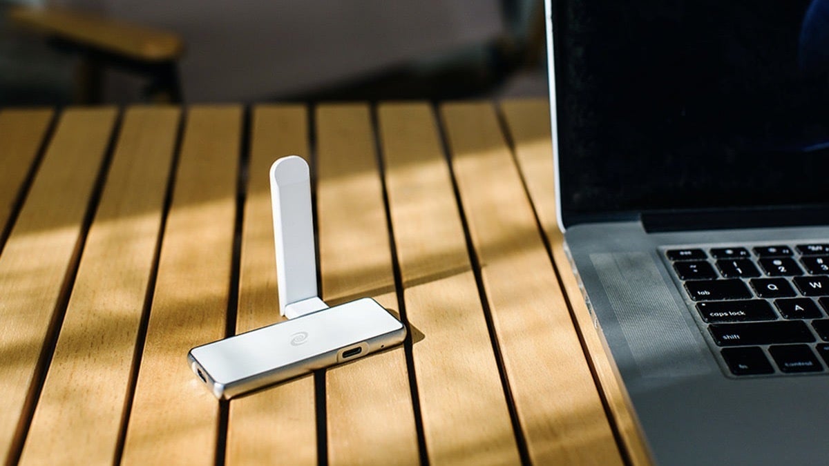 Deeper Connect Pico Decentralized VPN next to a laptop.