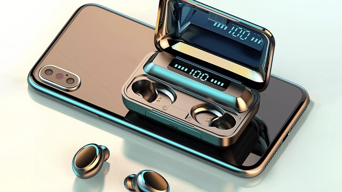 A pair of Flux 7 TWS Earbuds with Wireless Charging Case and Power Bank on a cell phone.