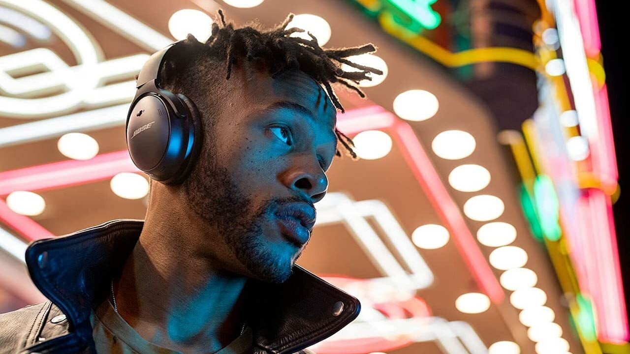 Person wearing Bose QuietComfort headphones