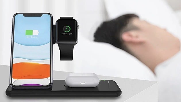 Person sleeping next to their Four-In-One Wireless Charger Stand.