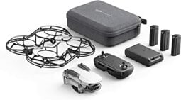 A drone along with other parts such as propellers, USB cables, batteries, etc.
