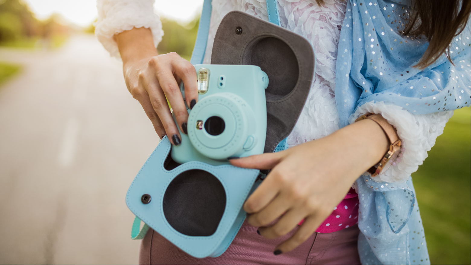 Girl holding Instax mini 