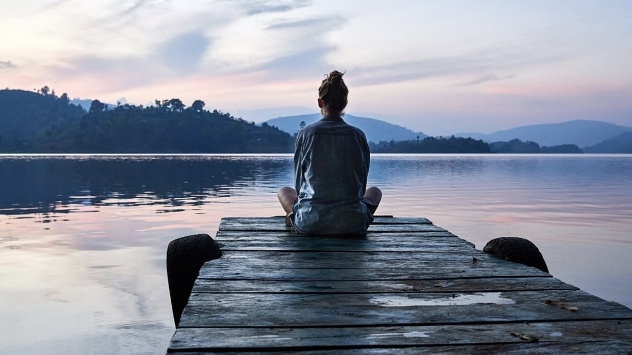 Girl looking out over lake