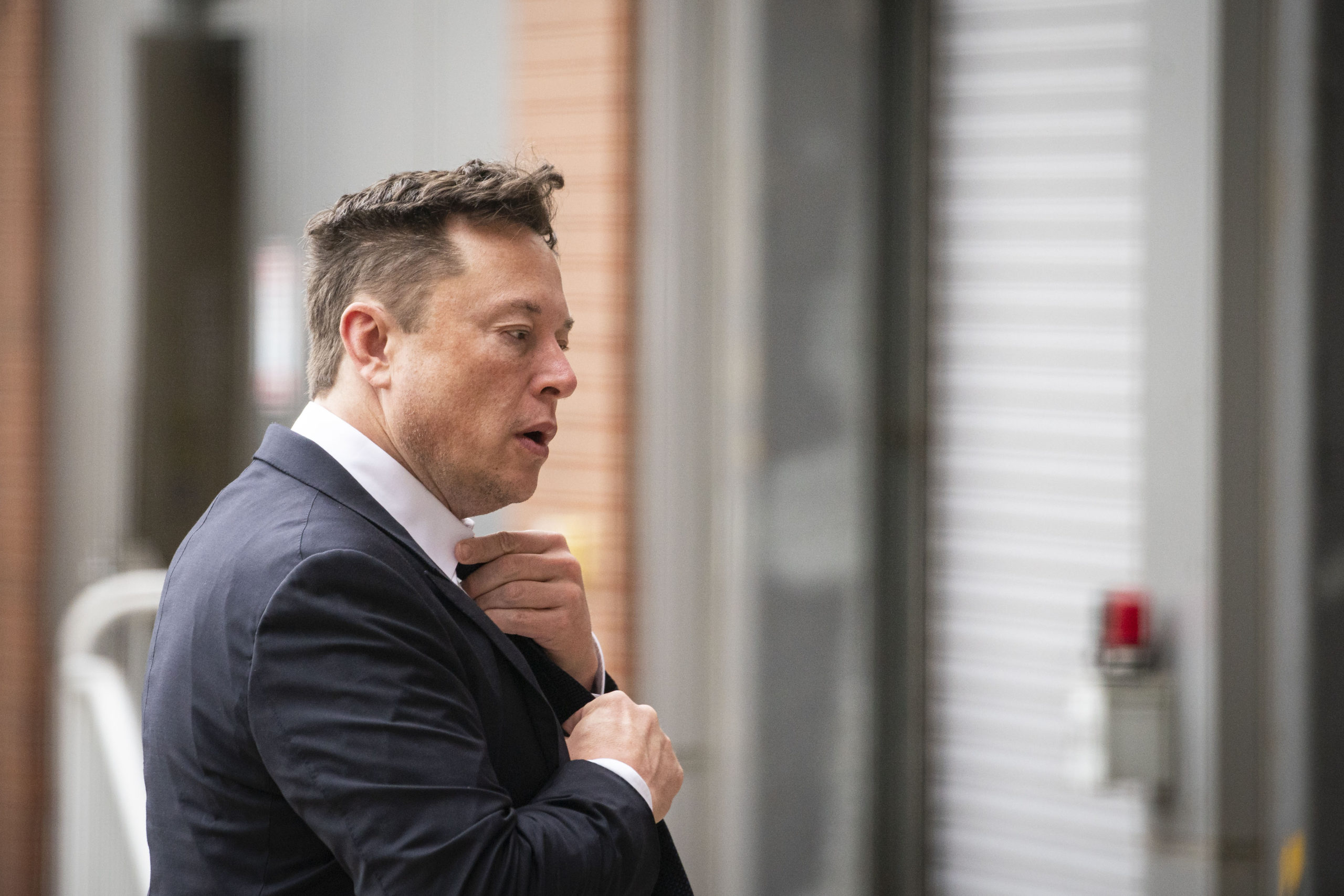 Elon Musk, chief executive officer of Tesla Inc., arrives at court during the SolarCity trial in Wilmington, Delaware, U.S., on Tuesday, July 13, 2021