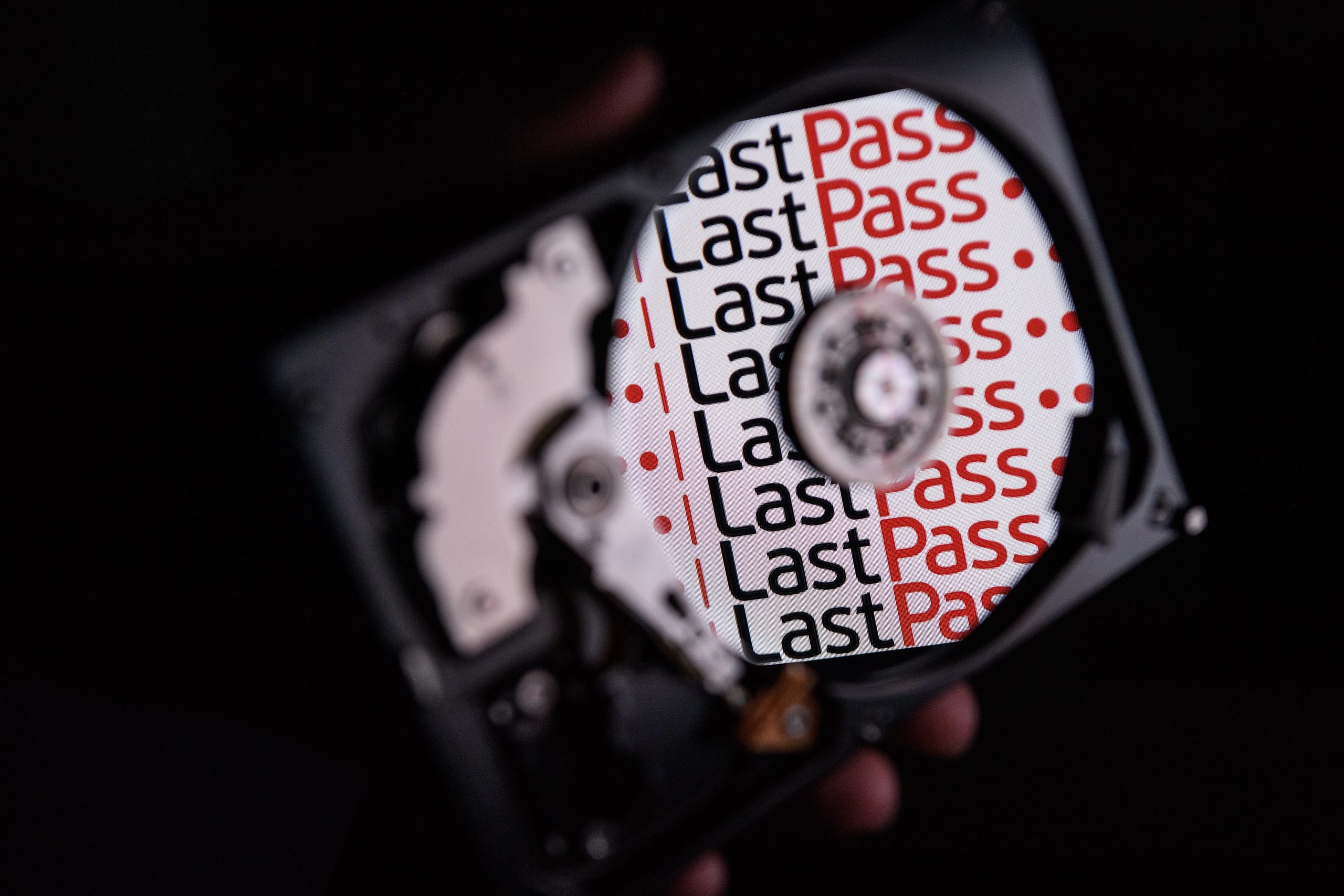 The Lasdtpass logo reflected in the mirror surface of a hard drive