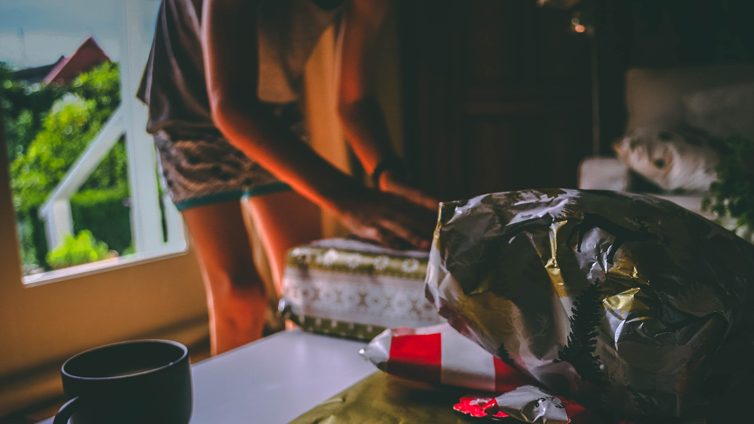 A lady wrapping gifts