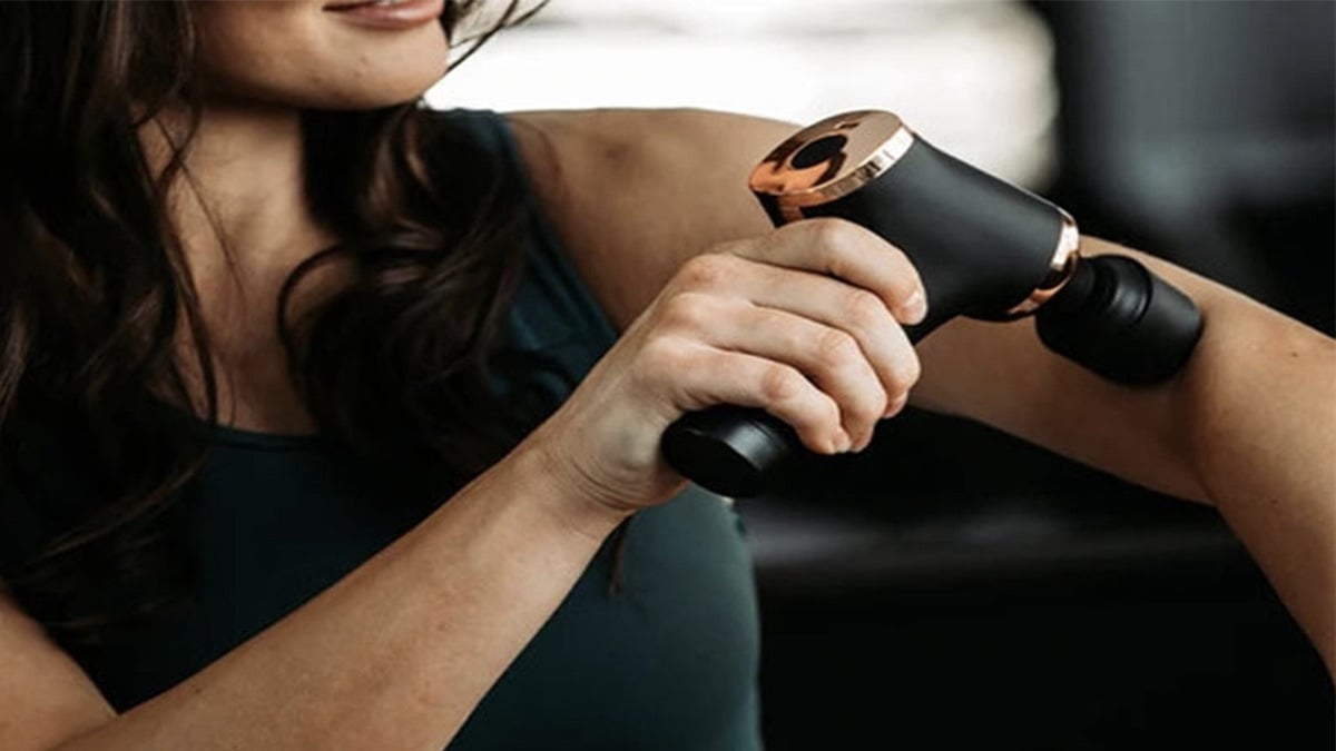 Person using the Evertone Prosage Copper Massager.
