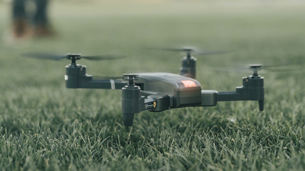 Refurbished Vivitar VTI Skyhawk Foldable Drone hovering over the ground.