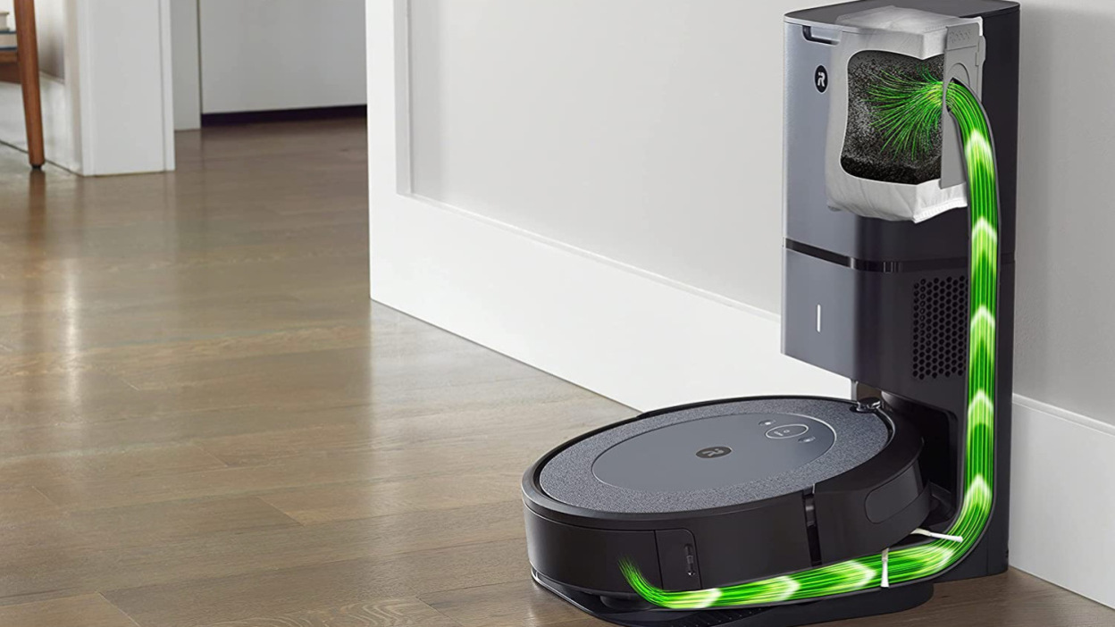 A smart vacuum robot in motion is lying in a room
