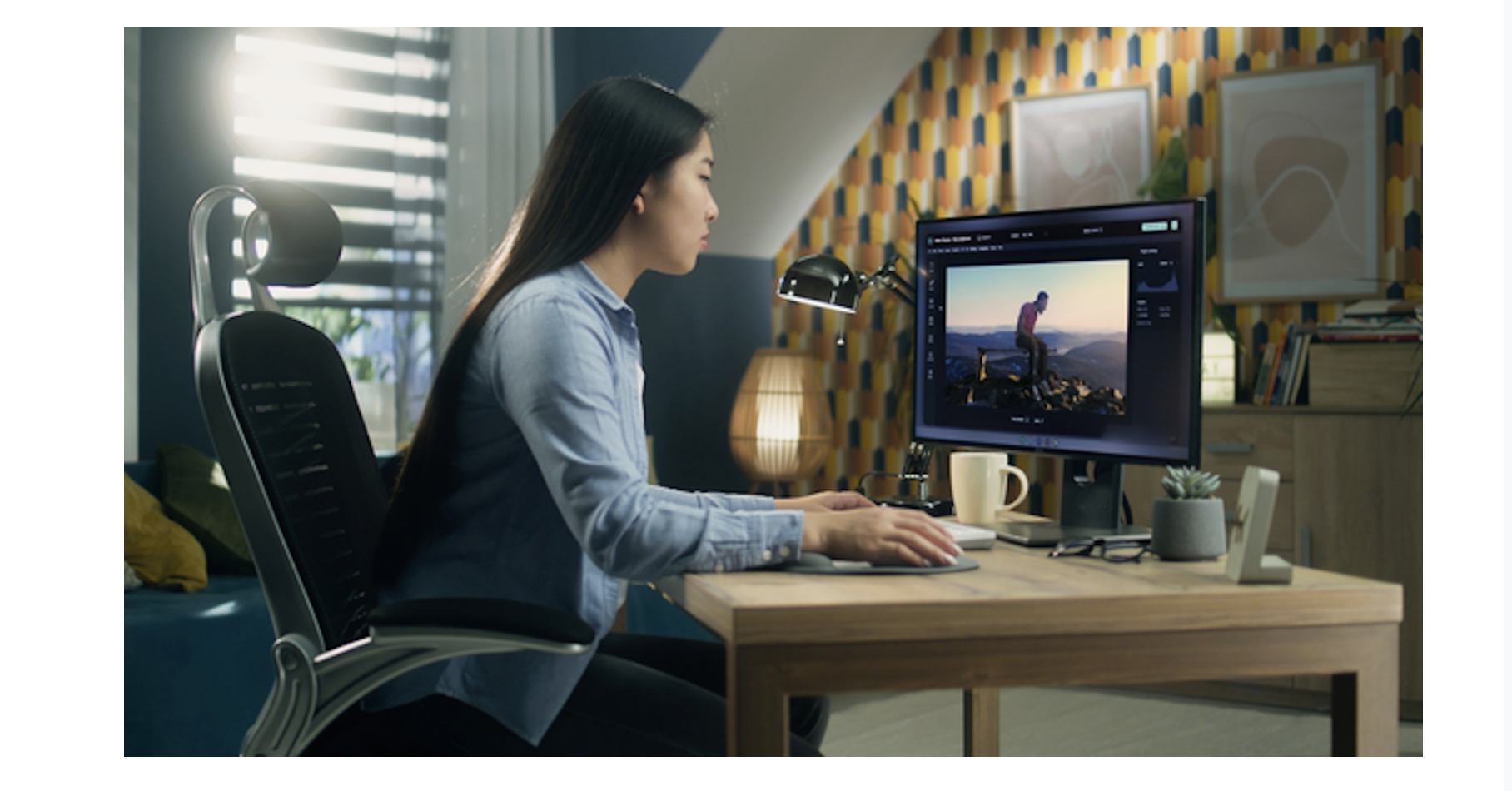woman sitting at desk working on computer