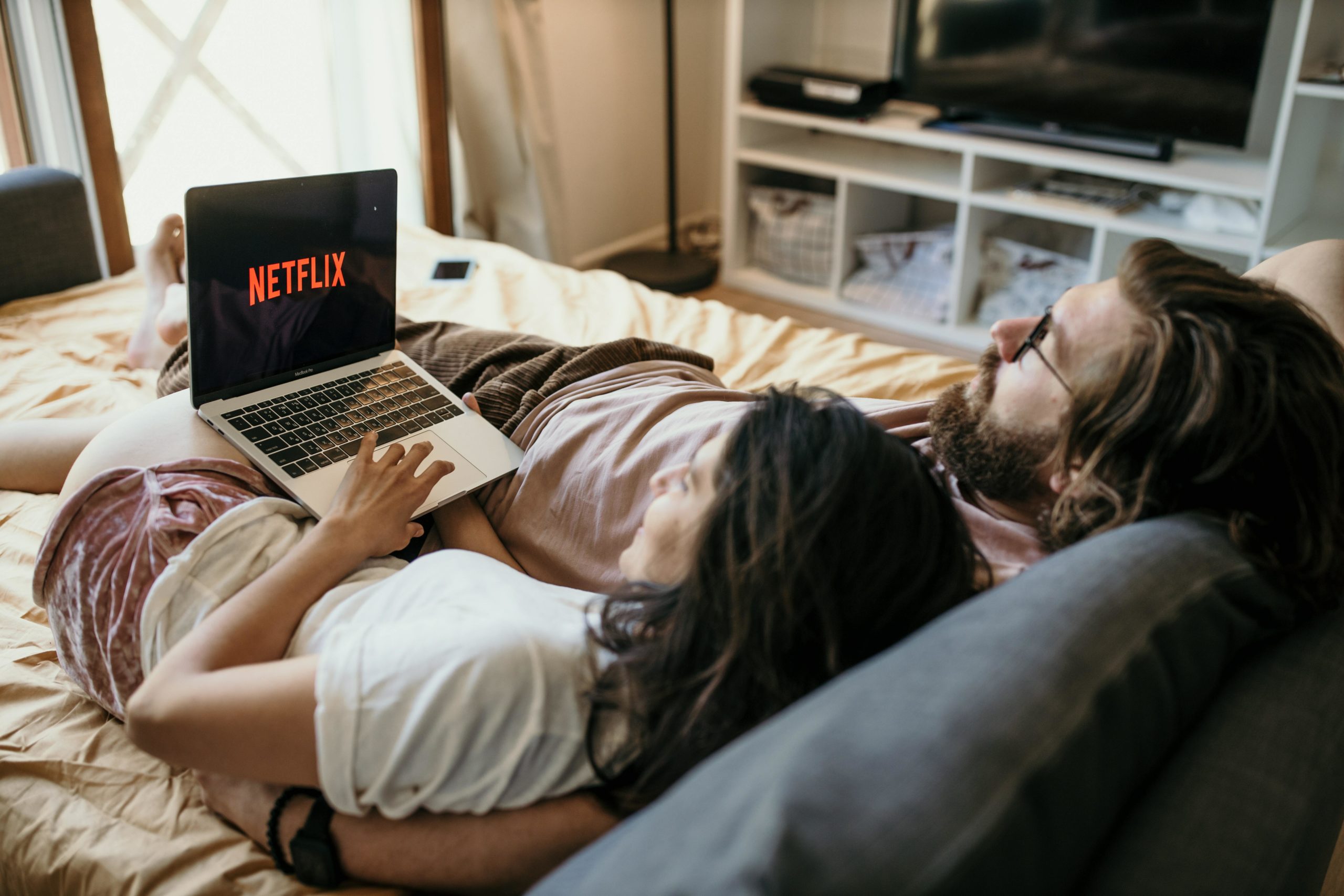 Couple watching Netflix on laptop