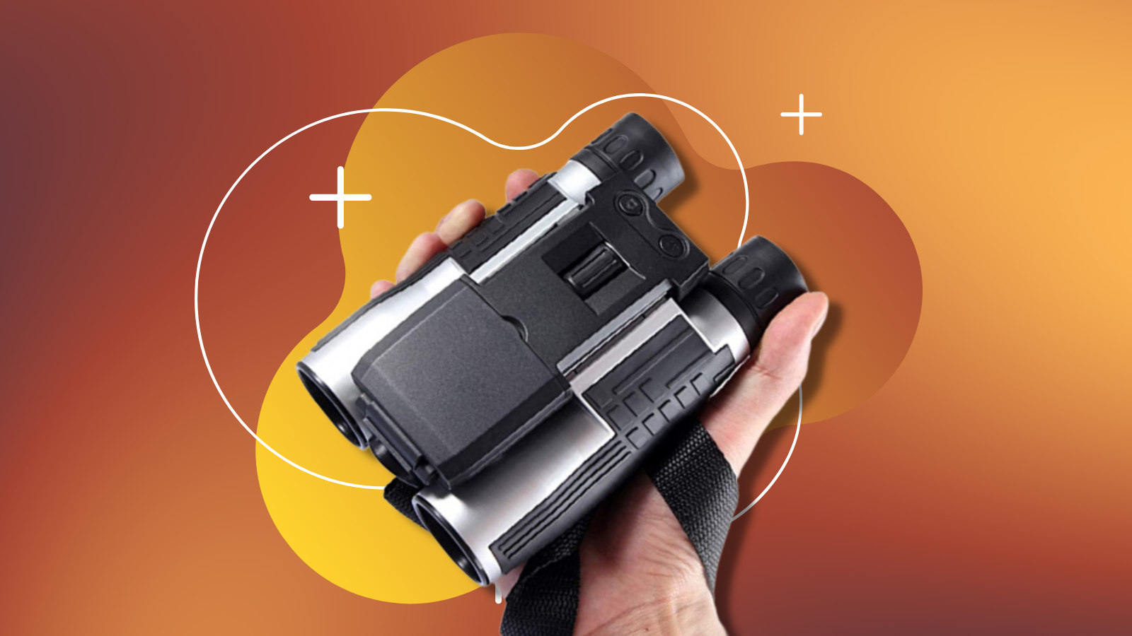 hand holding camera binoculars with orange background