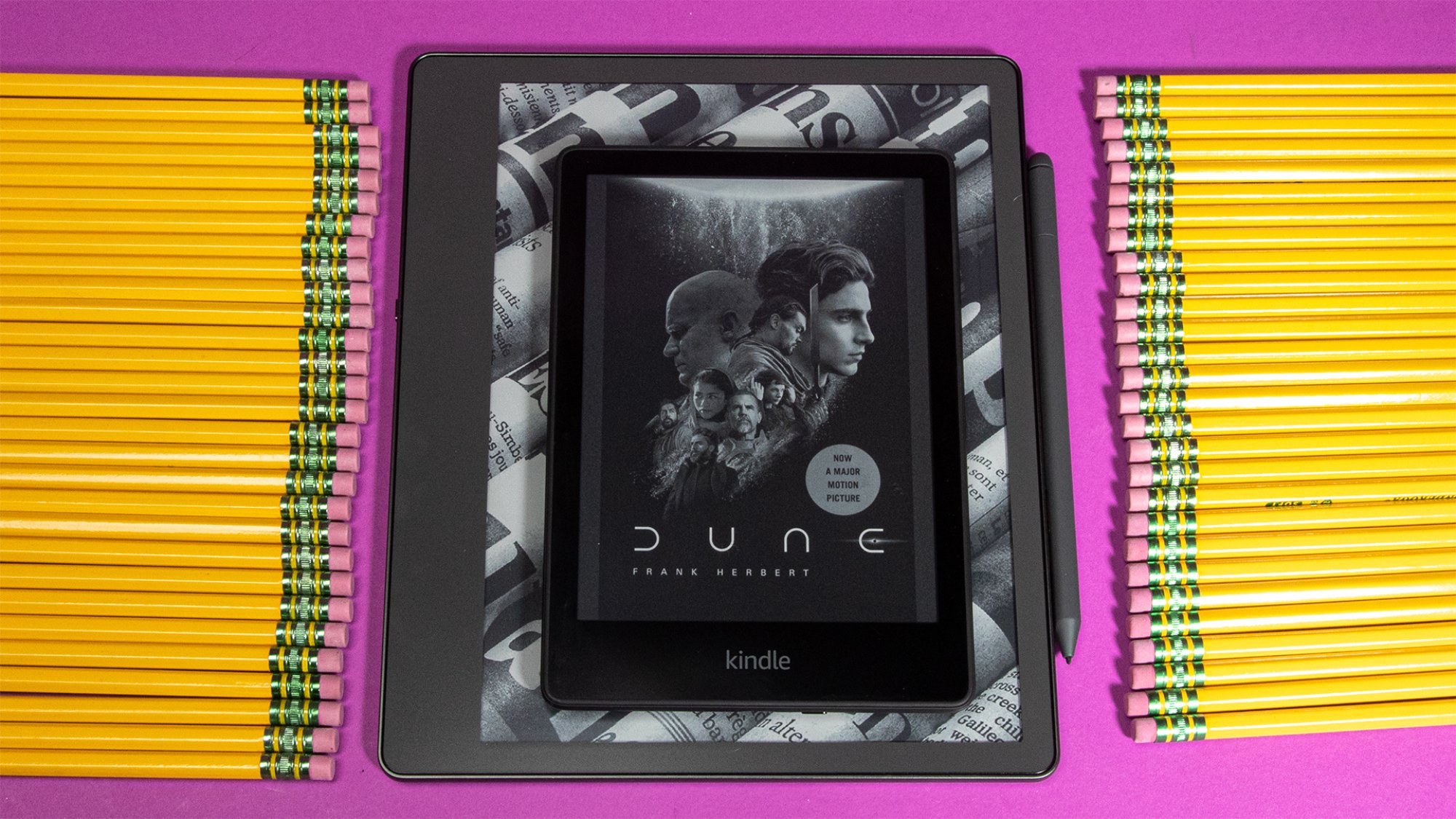 Kindle Paperwhite on top of Kindle Scribe for size comparison