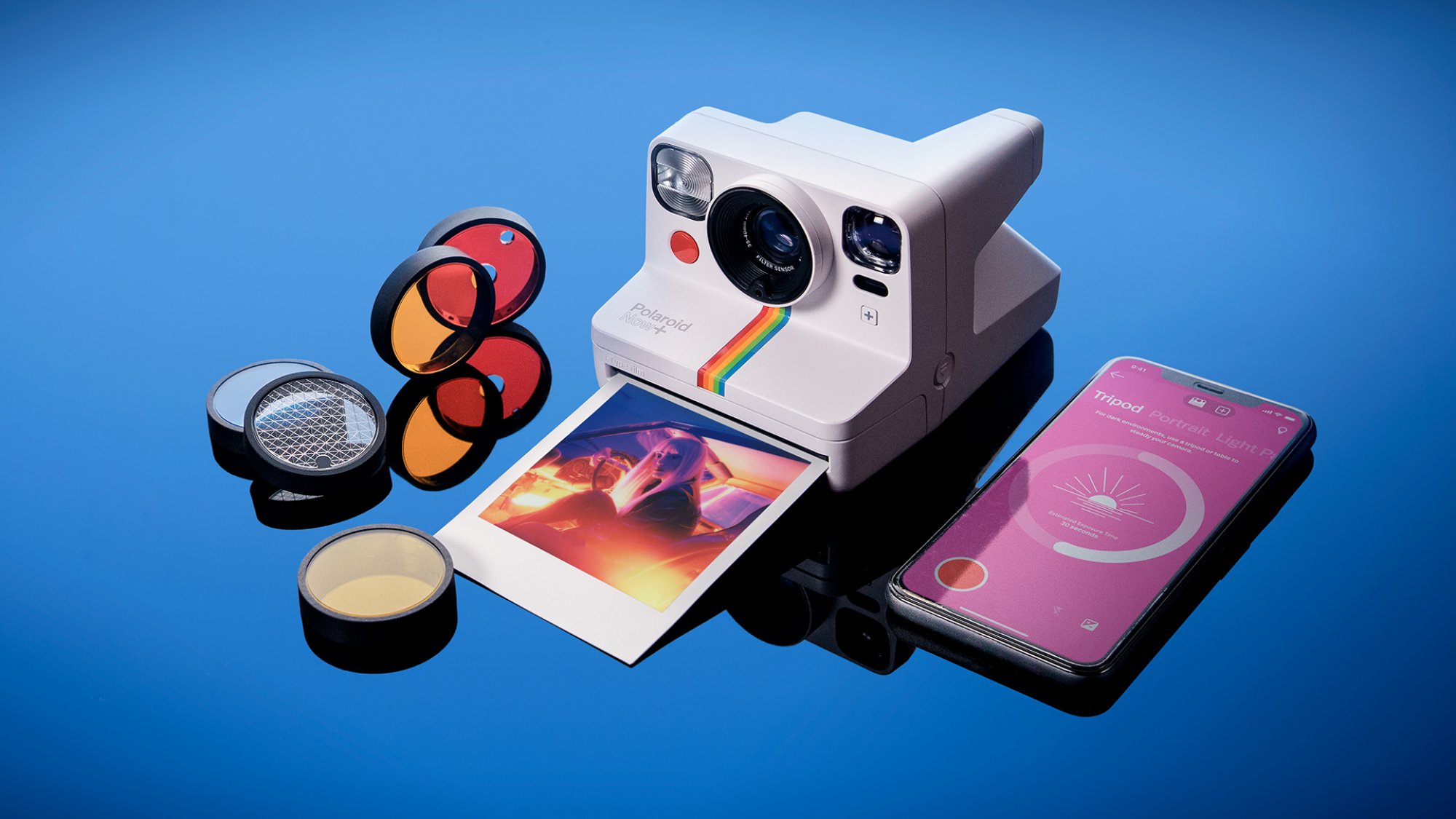 Polaroid Now+ laid out with all of its accessories