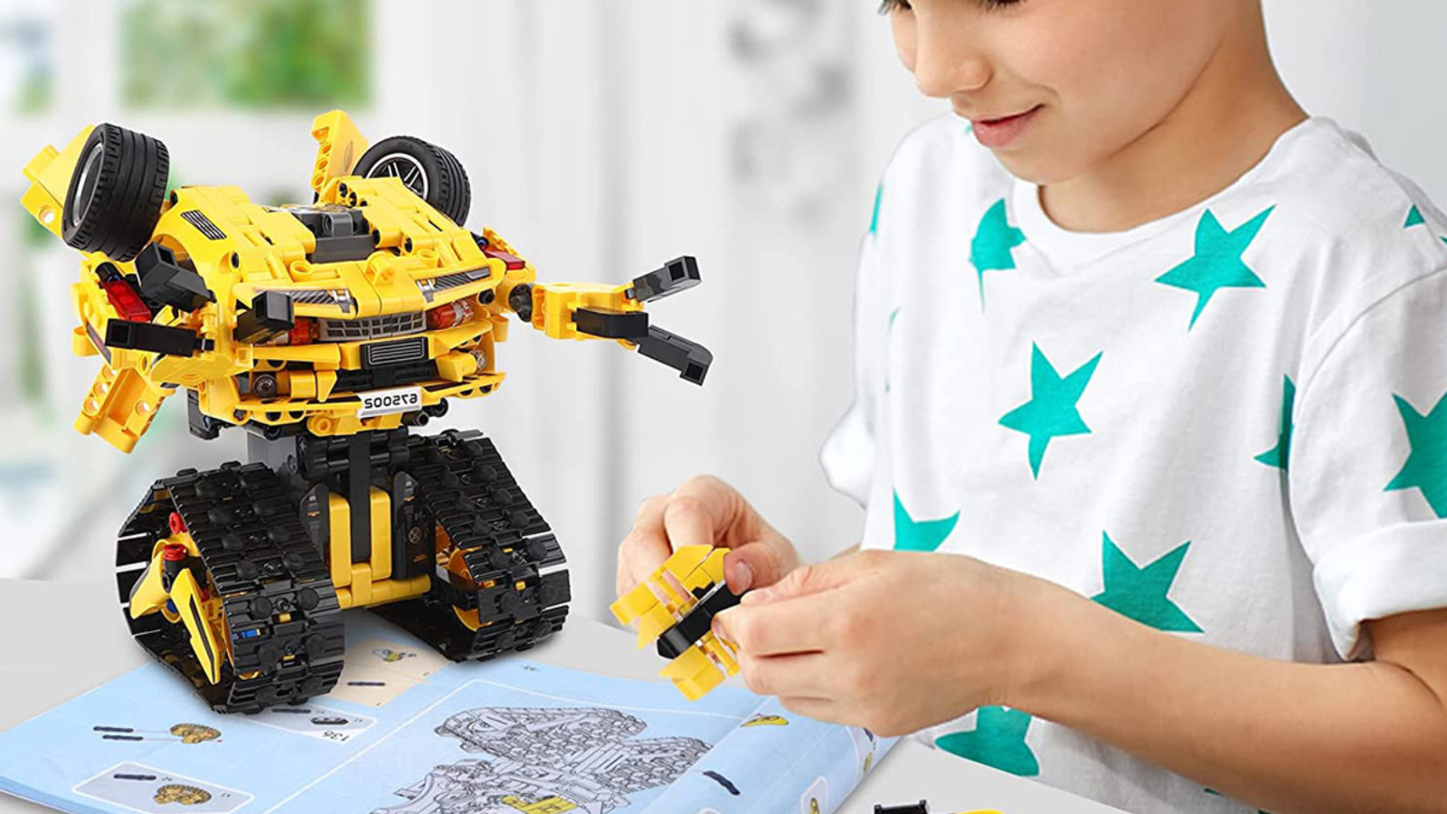 boy building robot at desk