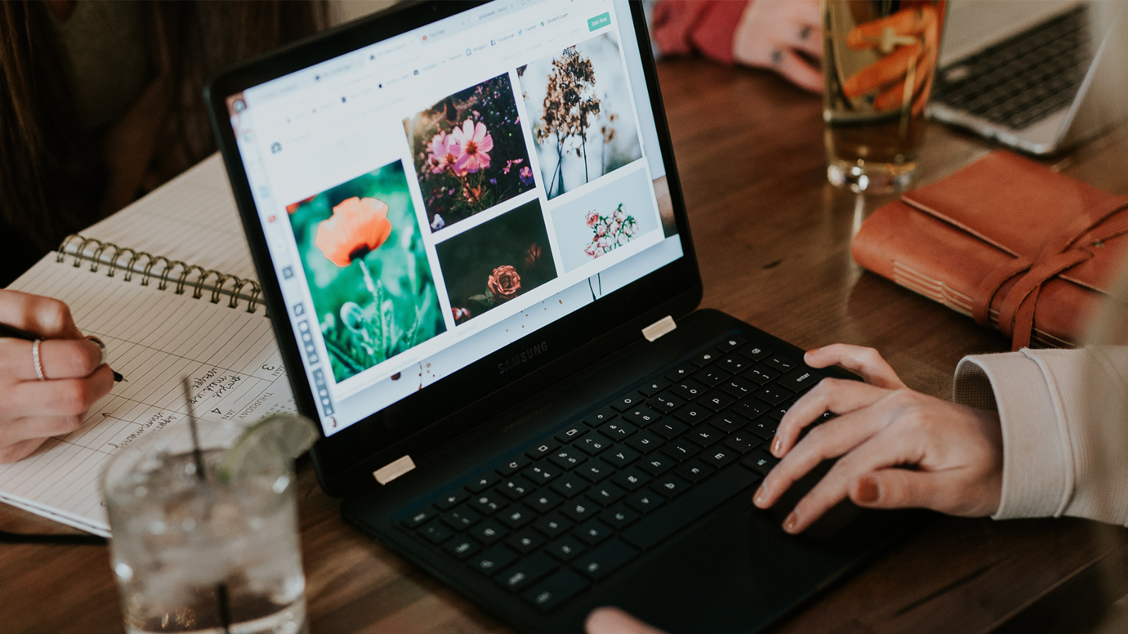 woman transferring photos on laptop