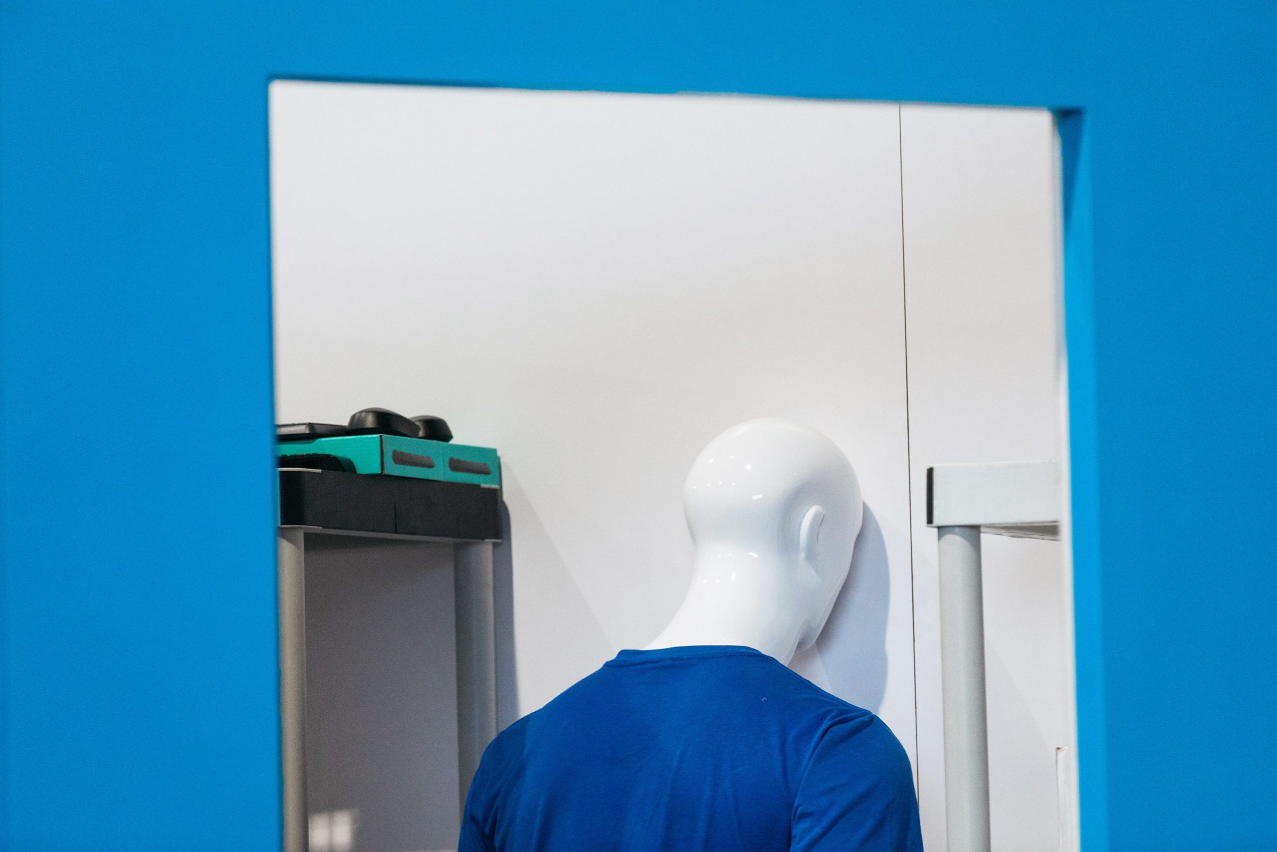 The back of a mannequin's head in a storage closet at CES