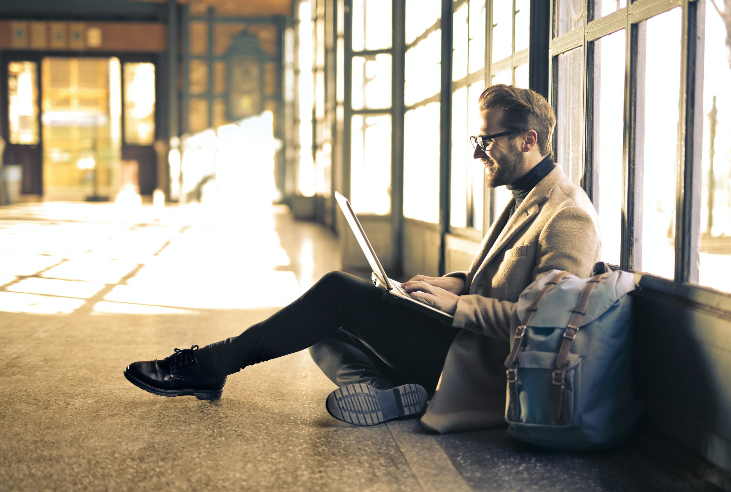 Man with laptop on lap